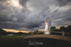 the nottinghamshire wedding photography golf venue moody sky bridge fountain bride groom portrait